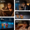 Vesper blue light glasses shown in five scenes — reading in bed, at a desk in the evening, close-up of the orange lenses, in front of a monitor, and relaxing on a sofa